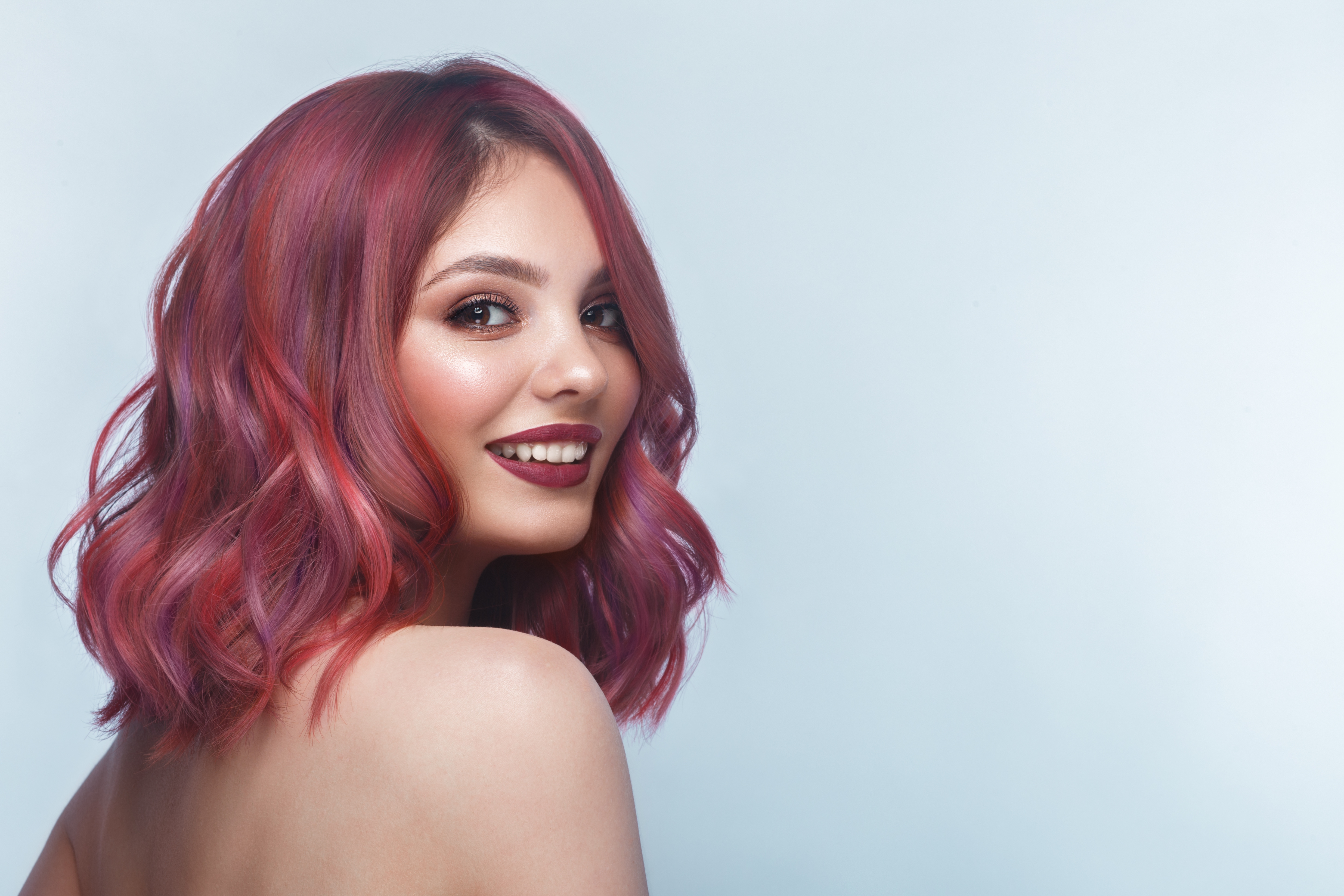 Woman with styled red hair